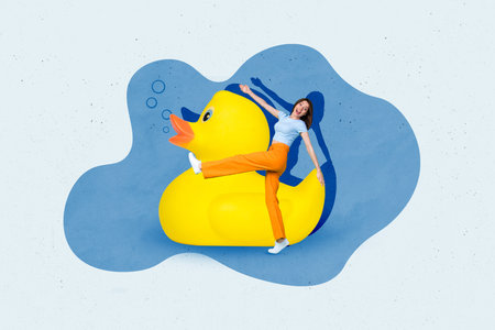 Creative photo poster of young careless positive girl have fun summertime walking yellow huge rubber duck bath time isolated on gray backgroundの写真素材
