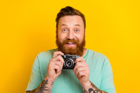 Portrait of cheerful man wear green trendy clothes spending free time favorite work hobby isolated...
