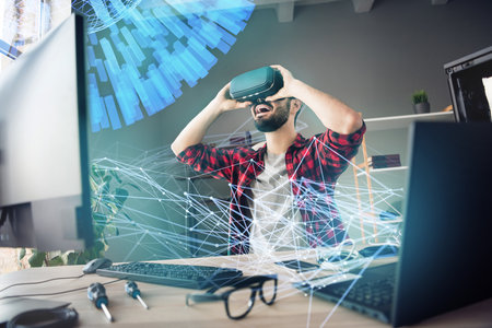 Artwork collage picture of excited guy metaverse game developer experience virtual reality glasses device laptop interactive hologramの写真素材