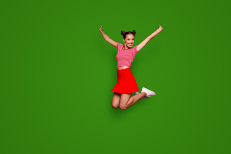 Full-length full-size view of jumping laughing and pretty woman dressed in colourful bright clothes...