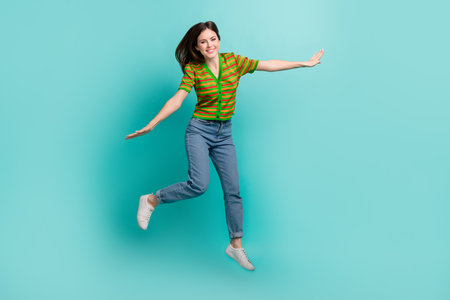 Full length photo of overjoyed cheerful pretty lady have fun dream flight abroad empty space...