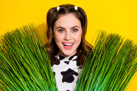 Portrait of positive surprised girl appear from green summer grass care farming concept isolated on...