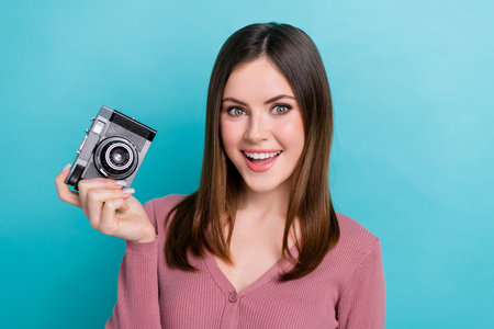 Portrait of impressed pretty woman stylish hairstyle wear purple shirt hold camera staring open...