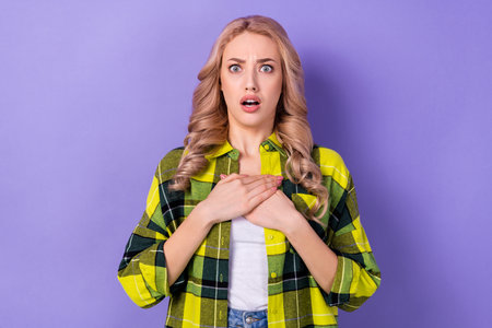 Photo of impressed speechless lady hands touch chest open mouth cant believe isolated on violet...