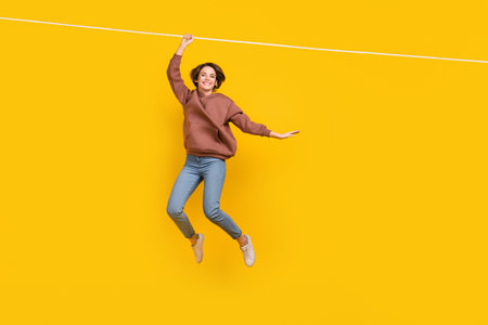 Full body photo of young charming lady hanging ropes lightness careless wear trendy clothes shopping...