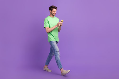 Full length size body photo of walk with smartphone funny blogger man gadget message writing chat...