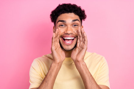 Close up photo of funny promoter guy pronouncing yelling novelty offer hands near mouth wear shirt isolated pink color backgroundの写真素材