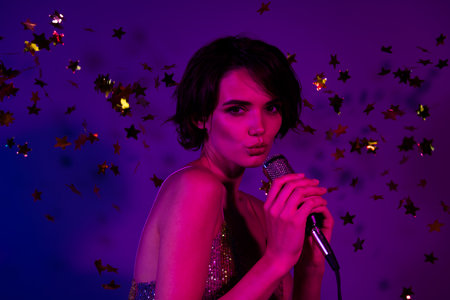 Photo of pop star lady have fun karaoke nightclub stage performance isolated bright neon color...