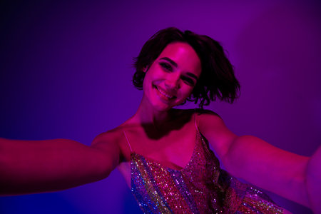 Portrait of positive pretty lady make selfie video call in night club celebrate event occasion...