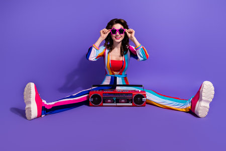 Full length photo of cool charming lady wear striped overall enjoying boom box discotheque songs...