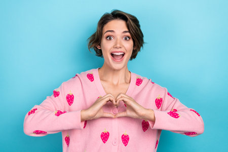 Portrait of overjoyed crazy cute girl wear stylish clothes two arm show you heart figure love...