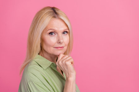 Close up photo of minded pensioner lady finger touch face wear stylish khaki clothes offer empty...