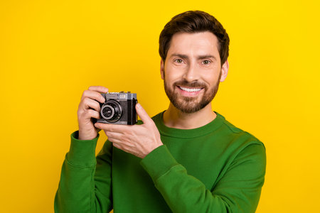 Photo of cheerful attractive man toothy smile wear trendy pullover like photographing digital camera...