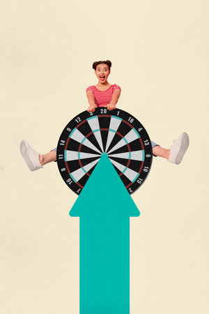 Vertical collage picture of astonished mini girl behind darts board target big arrow pointer isolated on beige backgroundの写真素材