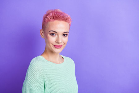 Photo of cheerful pretty girl wear turquoise sweater smiling empty space isolated violet color...