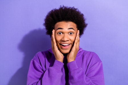 Photo of young guy unexpected reaction hands cheeks speechless staring how great carpathian...