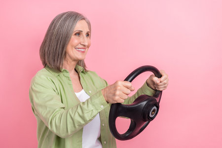Photo of cheerful pensioner lady wear trendy clothes buy drive new own car look road empty space...