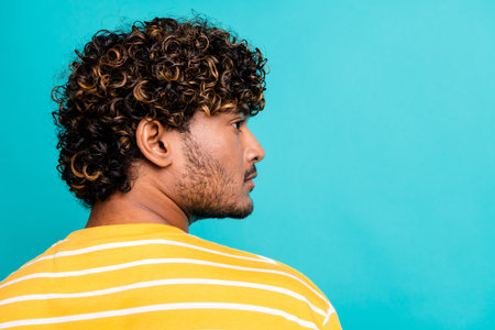 Profile photo of serious focused nice man look empty space advert blank isolated on teal color backgroundの写真素材