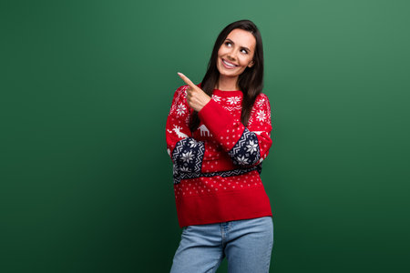 Portrait of cute cheerful person look direct finger empty space newyear ad isolated on green color backgroundの写真素材