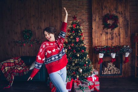 Photo of adornment christmas tree festive atmosphere vibe hand up dance relaxing lady young age isolated on home decoration backgroundの写真素材
