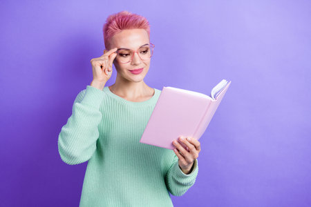Photo of clever charming girl wear turquoise sweater arm hand spectacles enjoying book empty space...