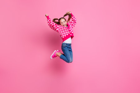 Full length photo of charming glamour girl champion stylish denim clothes scream yes hooray empty space isolated on pink color backgroundの写真素材