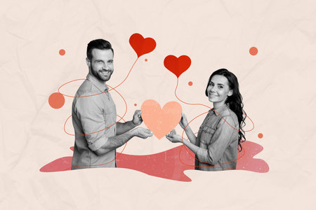 Horizontal cute photo collage of two sweet lovers couple look at camera hold heart shape card together on pastel pink drawing backgroundの写真素材