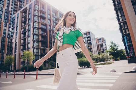 Photo of dreamy thoughtful girlfriend model wear trendy apparel look clear sky sunny summer day without clouds urban city outsideの写真素材