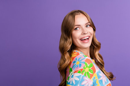 Side photo of funny girl blonde hair curls looking empty space hairdresser salon fixing her style isolated on violet color backgroundの写真素材