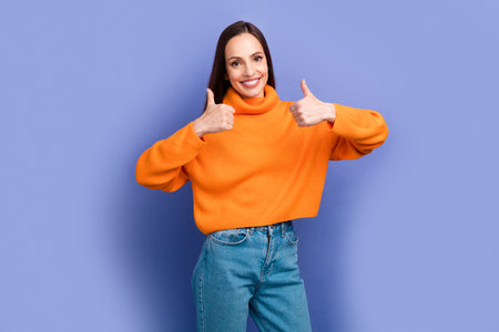 Photo of cheerful mature lady on banner showing double thumbs up approve your request for help isolated on violet color backgroundの写真素材