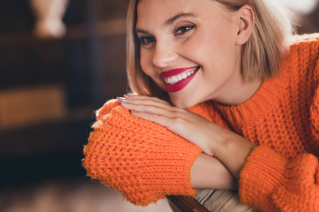 Close up cropped portrait of stunning person sit comfy chair beaming smile pastime calmness flat insideの写真素材