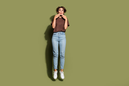 Full length photo of impressed girl wear oversize t-shirt pants jumping staring at big season sale...