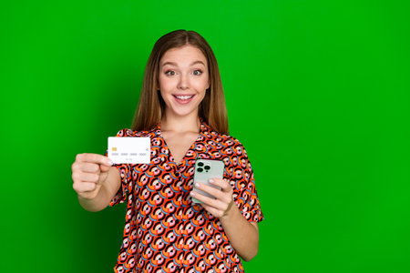 Portrait of beautiful teen with long hairstyle wear print blouse show you credit card hold...