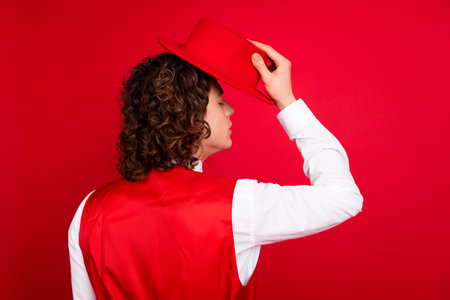 Rear view photo of classy teenage boyfriend wearing stylish elegant hat headwear posing like...