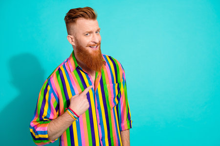Photo of positive nice man wear trendy clothes arm pointing indicating himself empty space isolated on cyan color backgroundの写真素材