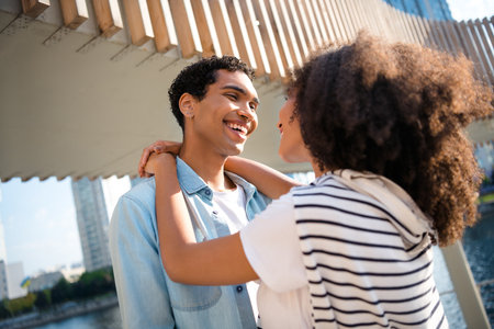 Closeup photo of curly hair lady embrace touch neck talking about common future and healthy relationships family outdoors river backgroundの写真素材