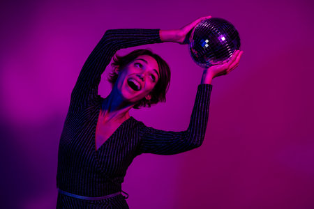 Photo portrait of attractive young woman hold look discoball dressed stylish overall clothes...
