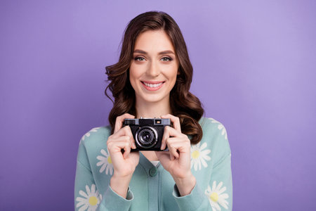 Photo of young amateur woman smiling photographer shooting you without flashlight creating content...