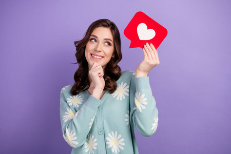 Photo of beautiful young attractive woman wearing stylish cardigan she holding red symbol heart...