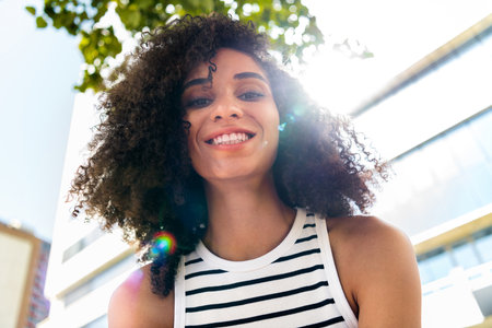 Photo of positive adorable shiny girl toothy smile rejoice weekend time pastime promenade sunny...