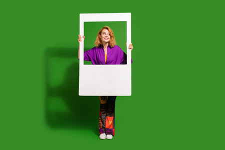 Photo portrait of lovely young lady instant photo frame look empty space dressed stylish violet...