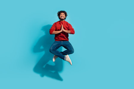 Full length size photo of guy jumping with clasped palms in lotus pose pleading praying for god help...