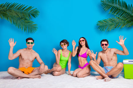 Photo of fellows girls guys gathering meeting on exotic coast greeting isolated blue color backgroundの写真素材