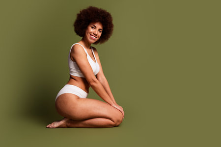 No filter photo of charming pretty lady underwear lingerie loving body positive empty space isolated khaki color backgroundの写真素材