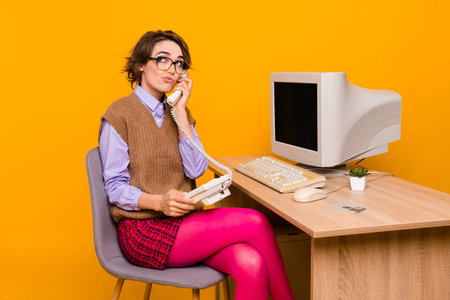 Photo of attractive young woman look unsure empty space talk phone dressed retro office clothes...