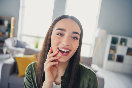 Photo of pretty young woman beaming smile laugh wear shirt modern interior apartment indoors