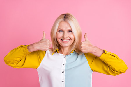 Photo of elegant aged lady show thumb up wear shirt isolated on pink color background