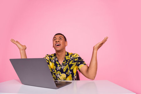 Photo of worker guy sit desk working laptop scream with despair isolated pastel color background