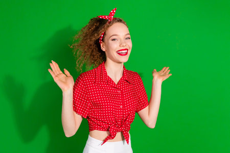 Photo portrait of attractive young woman raise hands excited dressed stylish red retro clothes...