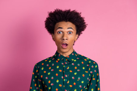 Photo of impressed speechless guy with wavy hairstyle dressed print shirt astonished staring at sale...
